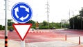 Traffic sign roundabout before circular intersection or junction Royalty Free Stock Photo