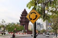 Traffic sign of roundabout and The Independence Monument, memorial Cambodian Independence Day after winning from the French Royalty Free Stock Photo