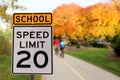 Traffic sign.  School zone  yellow warning board. Speed limit 20 Royalty Free Stock Photo