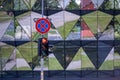 The traffic sign and semaphore with red light on the urban background, close-up Royalty Free Stock Photo