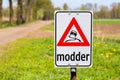 Traffic sign with text Modder or Mud along road Royalty Free Stock Photo