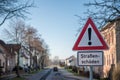 Traffic sign with warning `road damage` in German Royalty Free Stock Photo