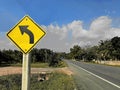 Traffic sign and warning signs on the road, that has a downhill slope