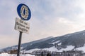 Snow chain obligation, Chain traffic sign. Winter time and winter services. Snow covered road, trees. Austria Royalty Free Stock Photo