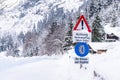 Snow chain obligation, Chain traffic sign. Winter time and winter services. Snow covered road, trees. Austria Royalty Free Stock Photo