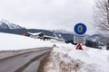 Snow chain obligation, Chain traffic sign. Winter time and winter services. Snow covered road, trees. Austria Royalty Free Stock Photo