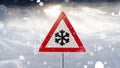 Road sign snow warns of snow and ice in winter, warning sign Royalty Free Stock Photo