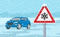 Traffic sign warns of snow and ice. Winter season suv car.