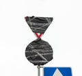 Traffic sign wrapped in black plastic