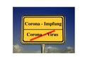 Traffic sign in yellow, marking the end of coronavirus pandemic due to available vaccination - the sign is in German language