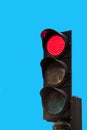 Traffic signal isolated on blue background, Madrid, Spain. Copy space for text. Vertical. Royalty Free Stock Photo