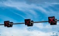 Traffic signal light with red color of cross sign on blue sky and white clouds background. Wrong sign. No entry traffic sign. Red Royalty Free Stock Photo