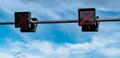 Traffic signal light with red color of cross sign on blue sky and white clouds background. Wrong sign. No entry traffic sign. Red Royalty Free Stock Photo