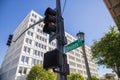 A traffic signal with a street sign that reads Union Street surrounded by lush green trees, a tall gray light post Royalty Free Stock Photo