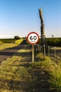 Traffic signpost, which indicates the maximum speed allowed at the location, on a road in Brazil