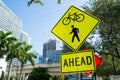 Traffic signs on city road in miami, usa. Bicycle and pedestrian crossing ahead warning. Transportation traffic and travel. Cautio Royalty Free Stock Photo