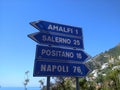 Traffic signs in Italy direction sign. Picturesque nature on the Amalfi coast.