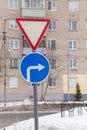 Traffic signs mean give way and turn right only at the edge of the road. Royalty Free Stock Photo