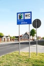 Traffic signs Petrol Station Equipped Only with Gas for Motor Vehicles and Public Toilet on city street