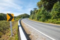 Traffic signs say the curve right direction on mountain highway, warning accident