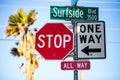 Traffic signs, stop all way and one way, and Surfside Blvd sign Royalty Free Stock Photo