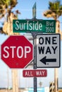 Traffic signs, stop all way and one way, and Surfside Blvd sign Royalty Free Stock Photo