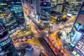 Traffic speeds through an intersection at night in Gangnam, Seoul in South Korea