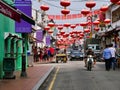 Traffic and tourists on a sunny day in Jonker Street / Jonker Walk in Malacca, Malaysia