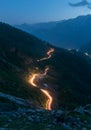 Traffic trails on rohtang pass at night. Crossing mountains in India Royalty Free Stock Photo