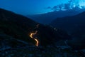 Traffic trails on rohtang pass at night. Crossing mountains in India Royalty Free Stock Photo