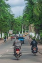 Traffic on a tree-lined street at the new Bastos Road in Yaounde, Cameroon