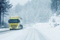 Traffic truck on winter road in snow blizzard Royalty Free Stock Photo