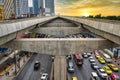 Traffic under the converging tracks of the BTS Skytrain from the Ratchayothin BTS station on the Sukhumvit Line Royalty Free Stock Photo