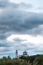 Tragic sky over church vertical frame