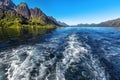 Trail behind of the ship on water surface on Trollfjord