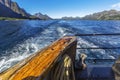 Trail behind of the ship on water surface on Trollfjord Royalty Free Stock Photo