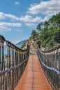 Trail Bridge at Rocky Coast in Summer