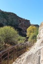 A trail carved into a mountainside along a creek in the mountains of the Sonoran Desert Royalty Free Stock Photo