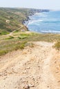 Trail, Cliffs, beach, mountains and vegetation in Canal beach