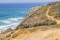 Trail, Cliffs, beach and waves in Arrifana