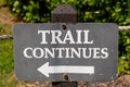 Trail Continues Sign With White Left Arrow on a Post Royalty Free Stock Photo