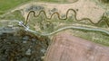 A trail follows a stream in springtime