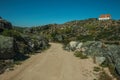 Trail in the highlands with a lonely house on top Royalty Free Stock Photo