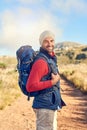 This trail isnt going to explore itself. Portrait of a happy hiker out on a mountain hiking trail on his own.