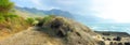 Trail, landscape and sky with ocean in nature for travel, adventure or hiking with mountain view in Hawaii. Pathway Royalty Free Stock Photo