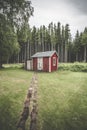 Trail leading up to a small red cabin Royalty Free Stock Photo