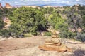 Trail marker made of stones by trekking path,