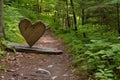 a trail marker in the shape of a heart or arrow