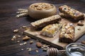 A trail mix bowl of dried fruit, raisins, cranberry with almonds, raisins, seeds, cashew, hazelnut nuts with honey. Vegetarian fit Royalty Free Stock Photo