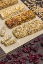 Trail mix, Cereal granola bars, raisins on wooden background Royalty Free Stock Photo